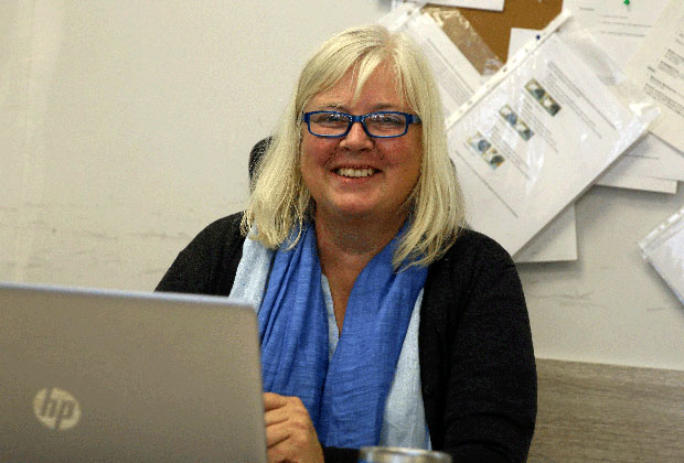 Ms. Cathrine Hoel by her desk